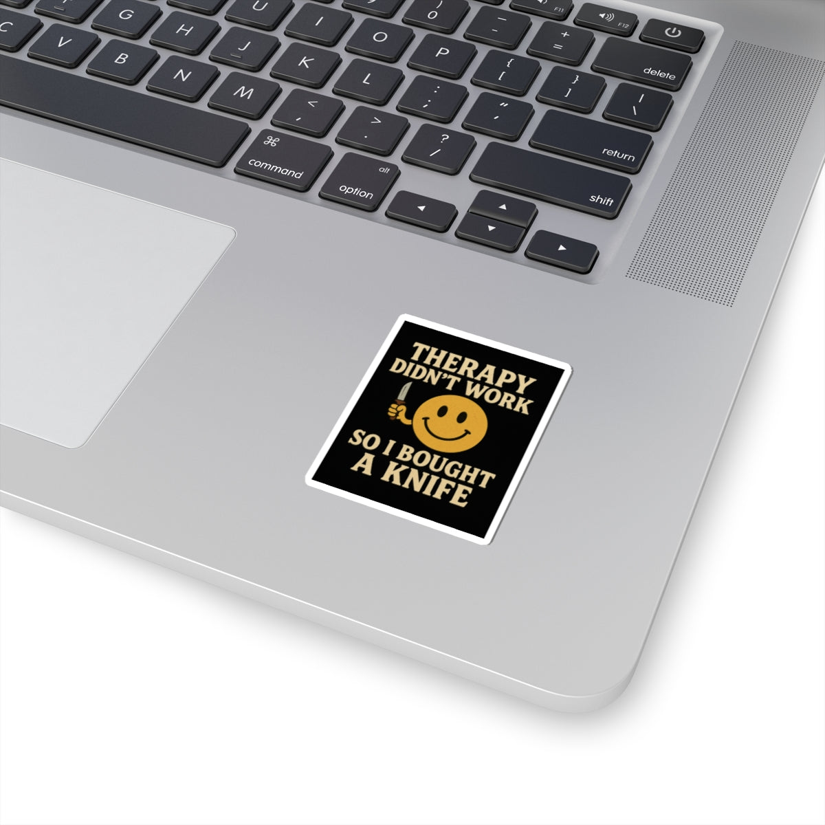 Therapy did not work so i bought a knife dark humor smiley sticker on a laptop keyboard