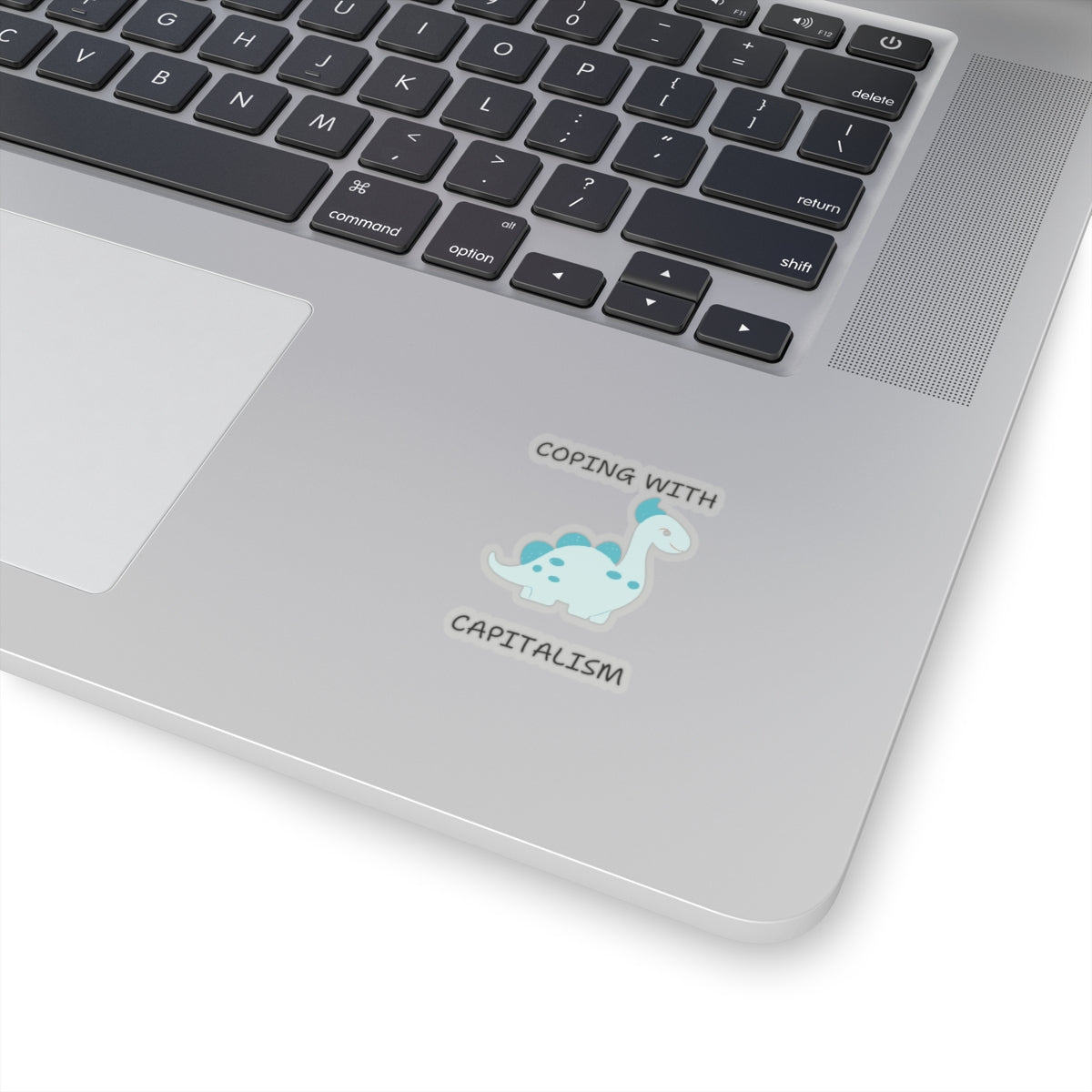 Unique sarcastic cute dinosaur sticker on silver laptop near keyboard by Printify