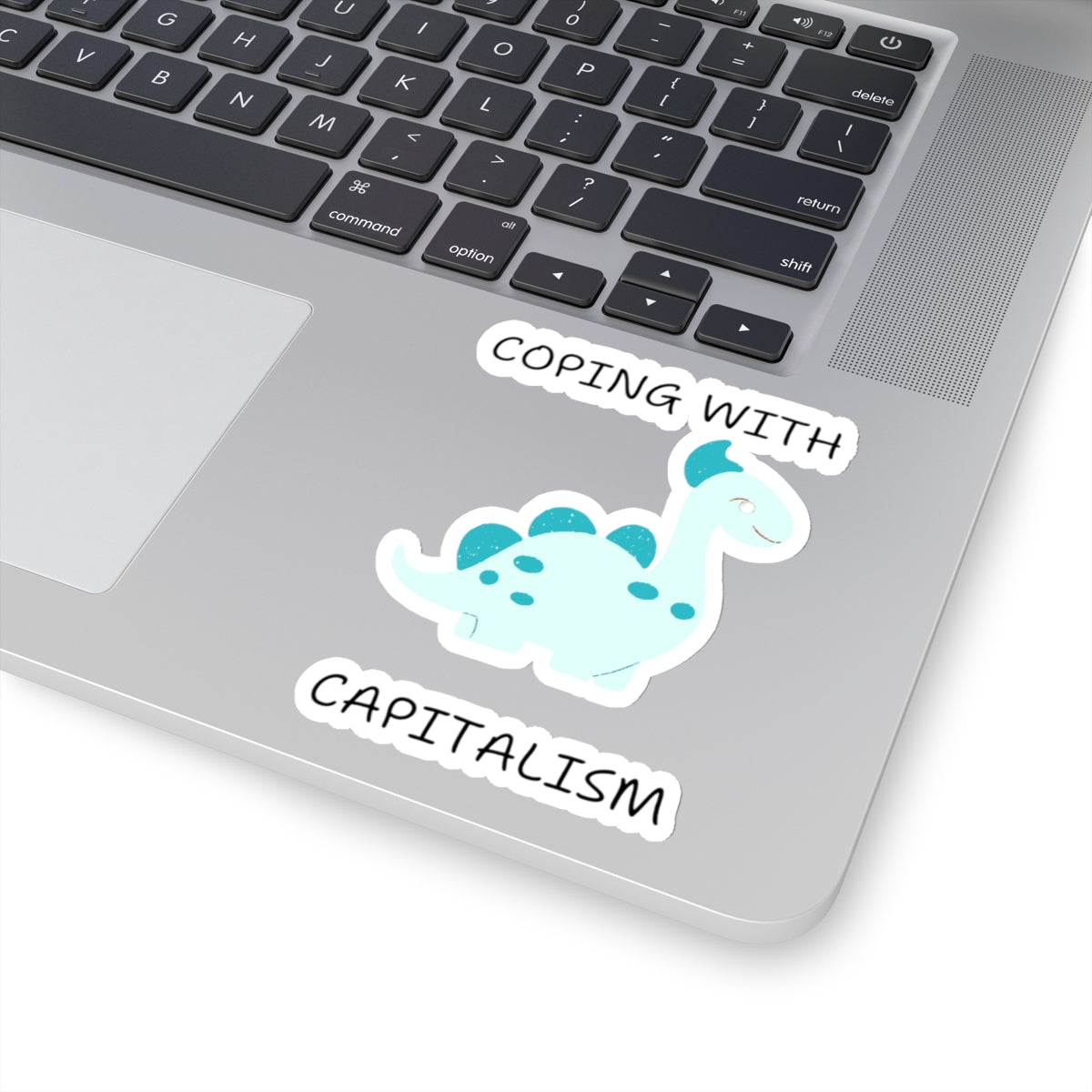 Unique sarcastic cute dinosaur sticker on laptop with text coping with capitalism printed by Printify