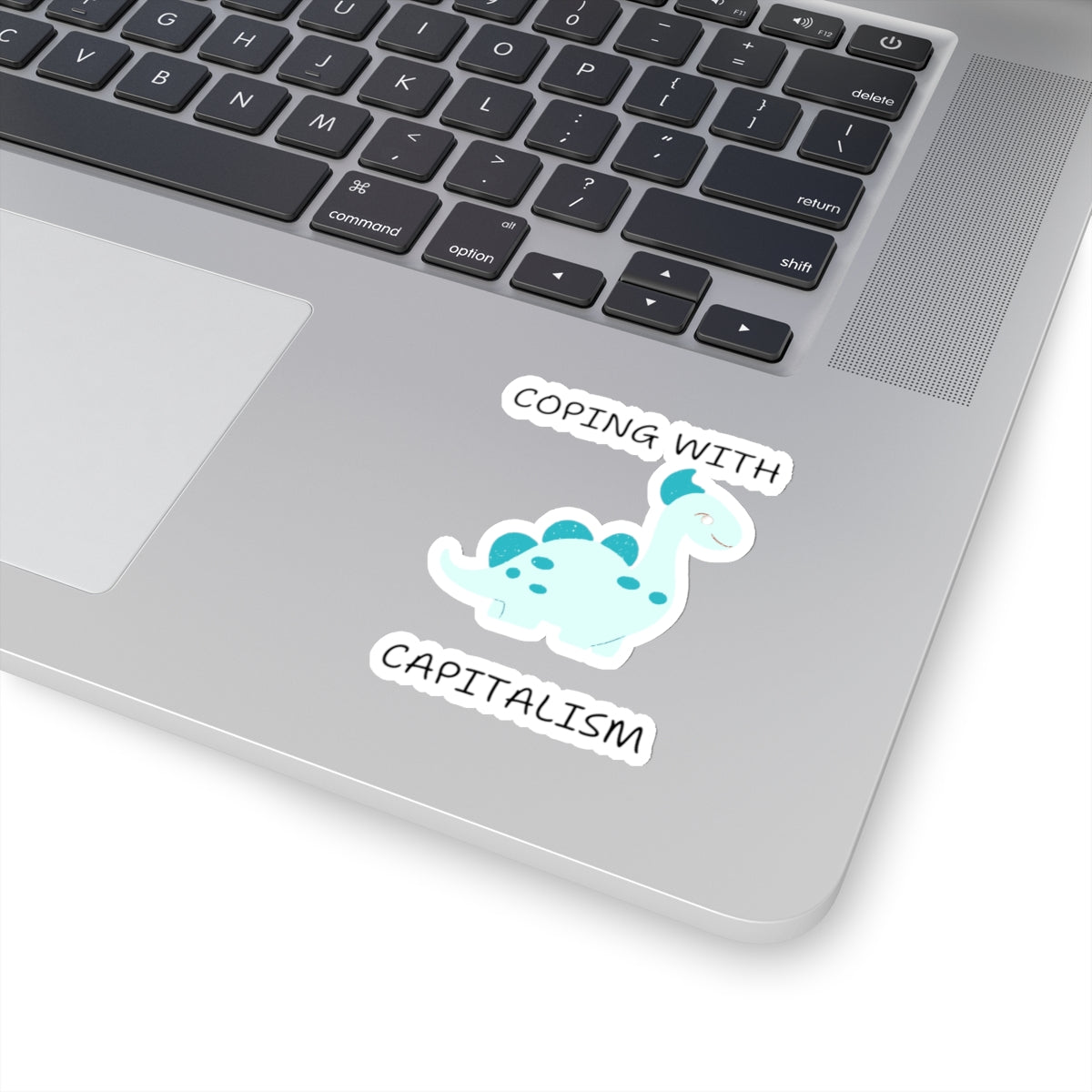 Unique sarcastic cute dinosaur sticker on laptop with phrase coping with capitalism from Printify