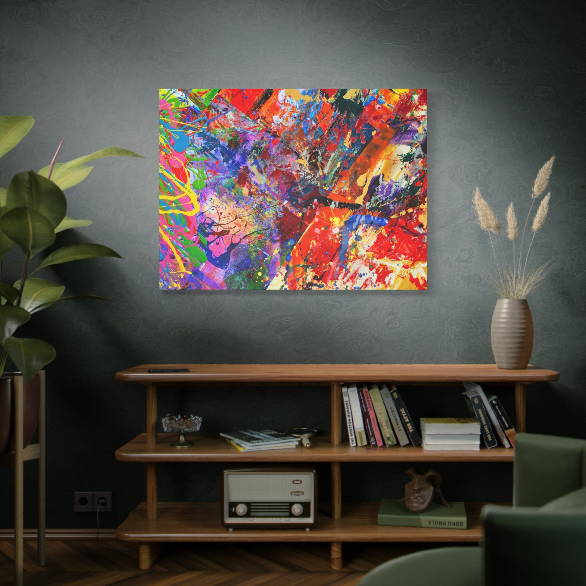Colorful canvas abstract art print kaleidoscope collision mounted on gray wall above wooden shelf
