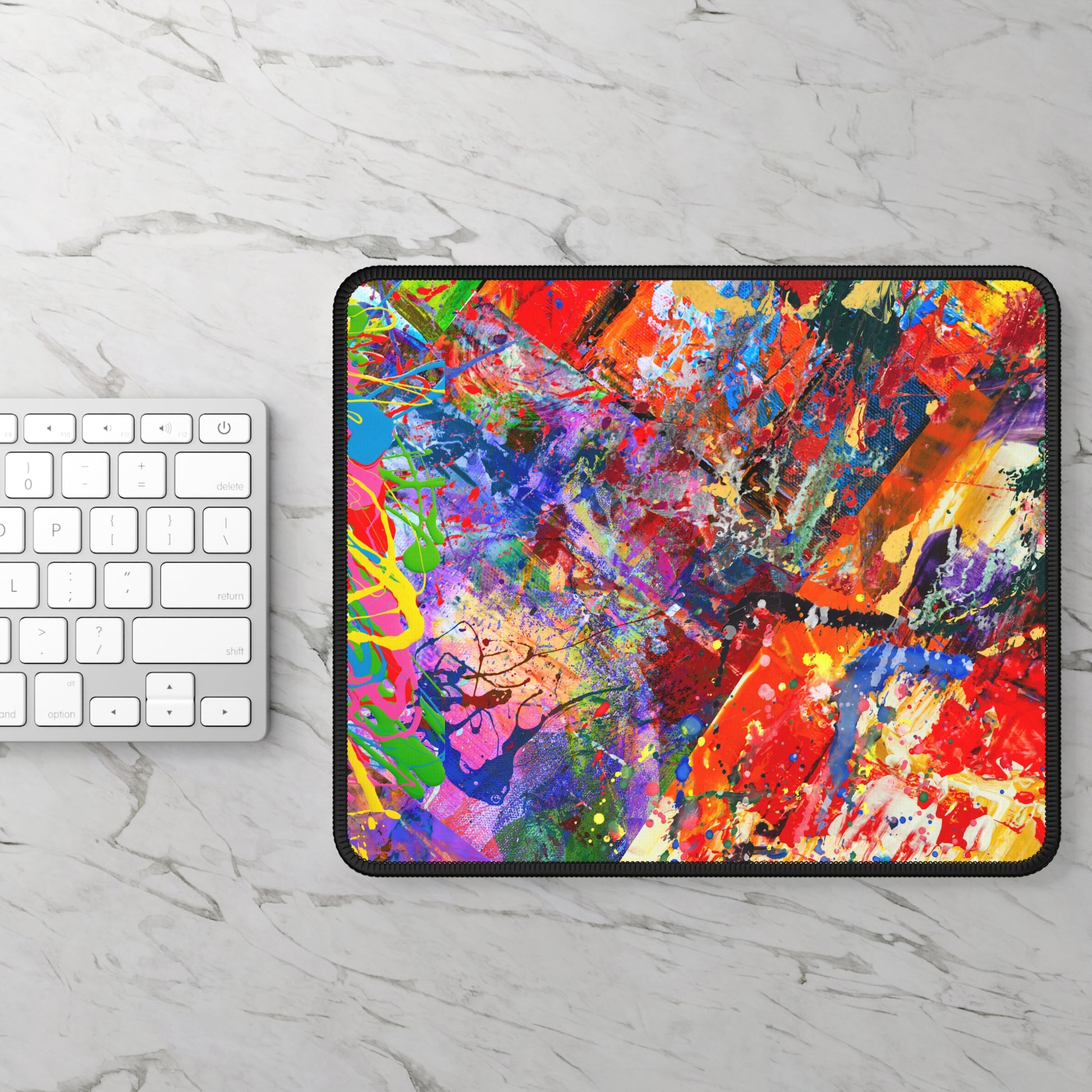 Printify kaleidoscope collision bold colorful abstract art mousepad on marble desk next to white keyboard