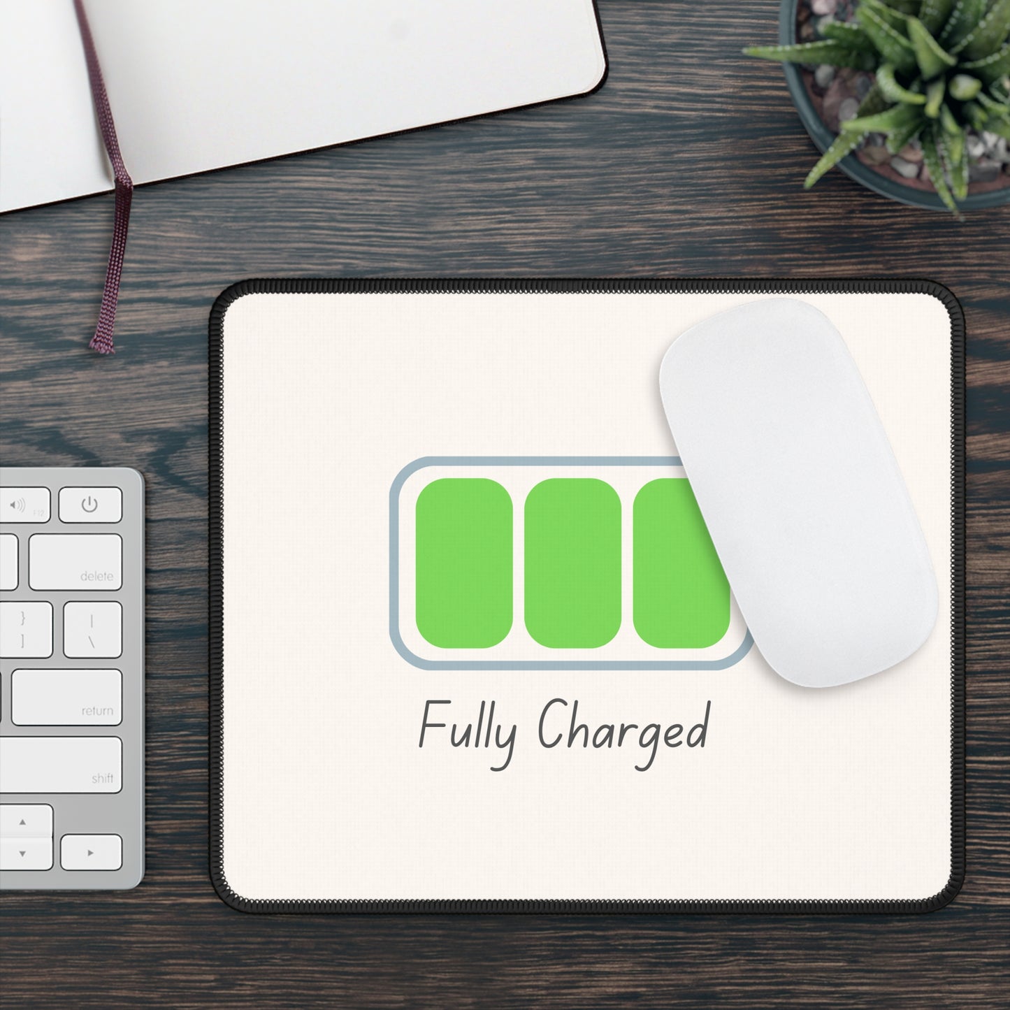 Printify fully charged gaming mouse pad with green battery icon white mouse keyboard and succulent on wood desk