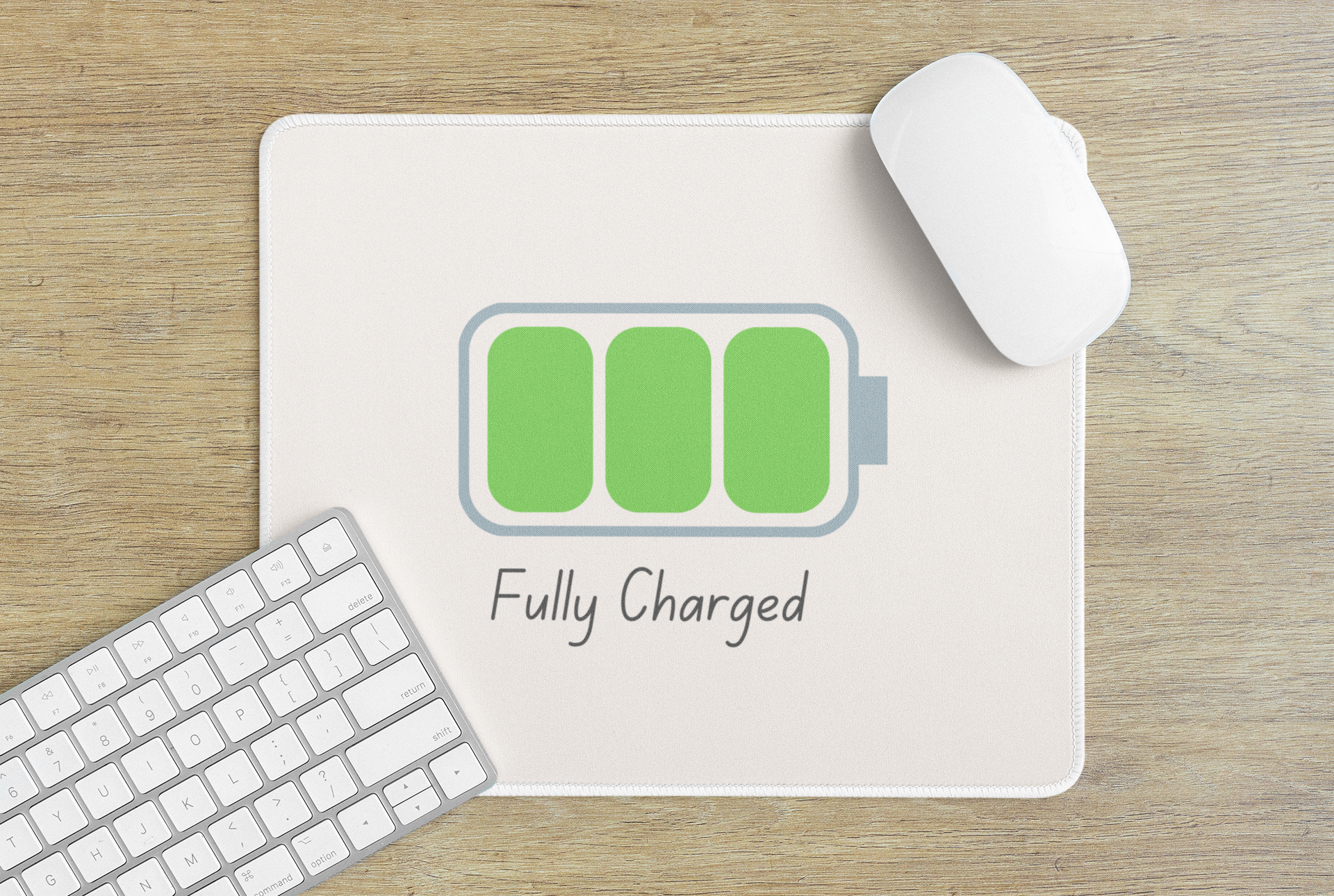 Printify fully charged gaming mouse pad on wood desk with white wireless mouse keyboard and green battery icon