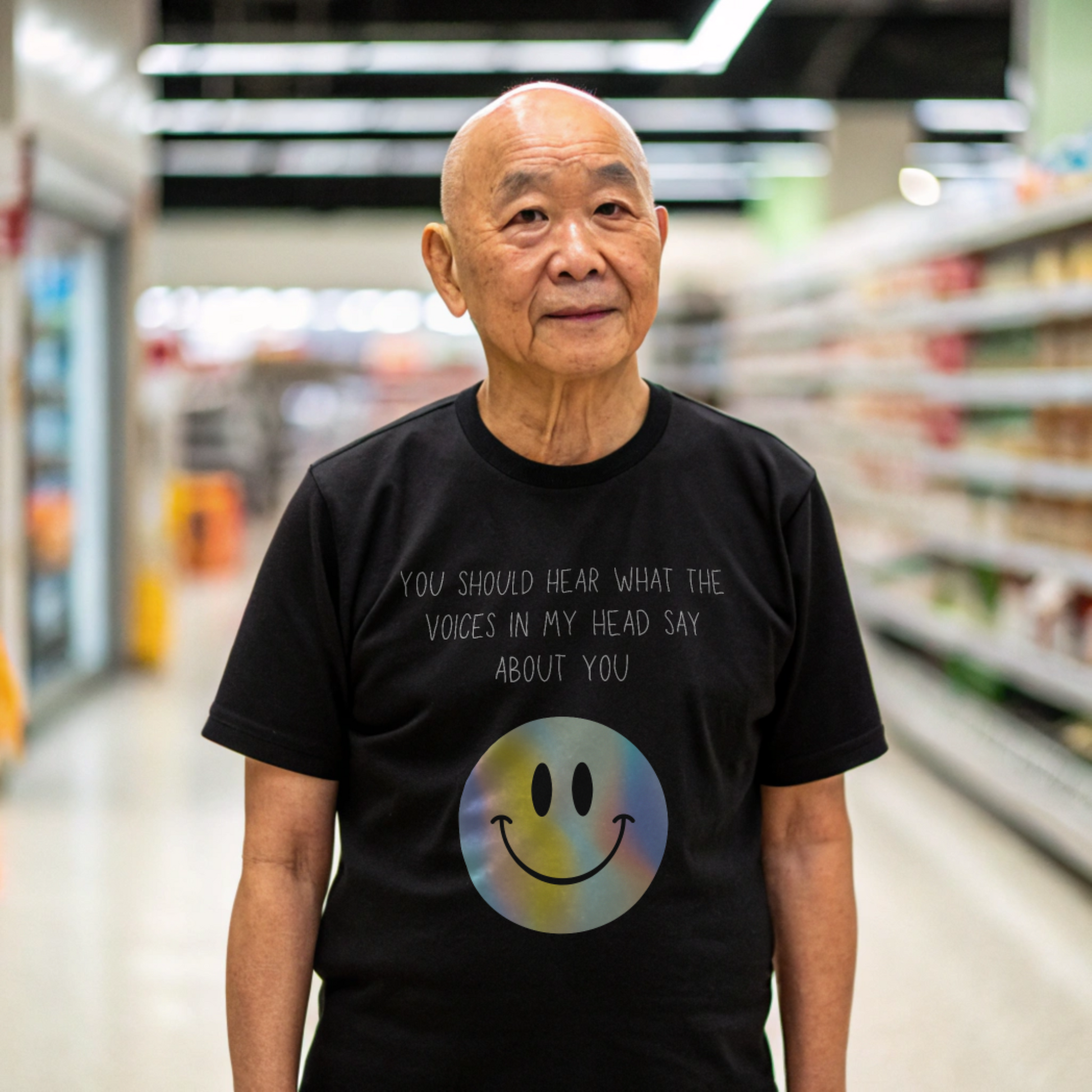 Voices in my head funny smiley face unisex shirt worn by an elderly man in a grocery store aisle